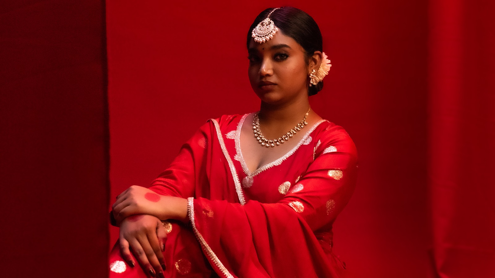 Campaign still for House Of Kamakhya — red on red